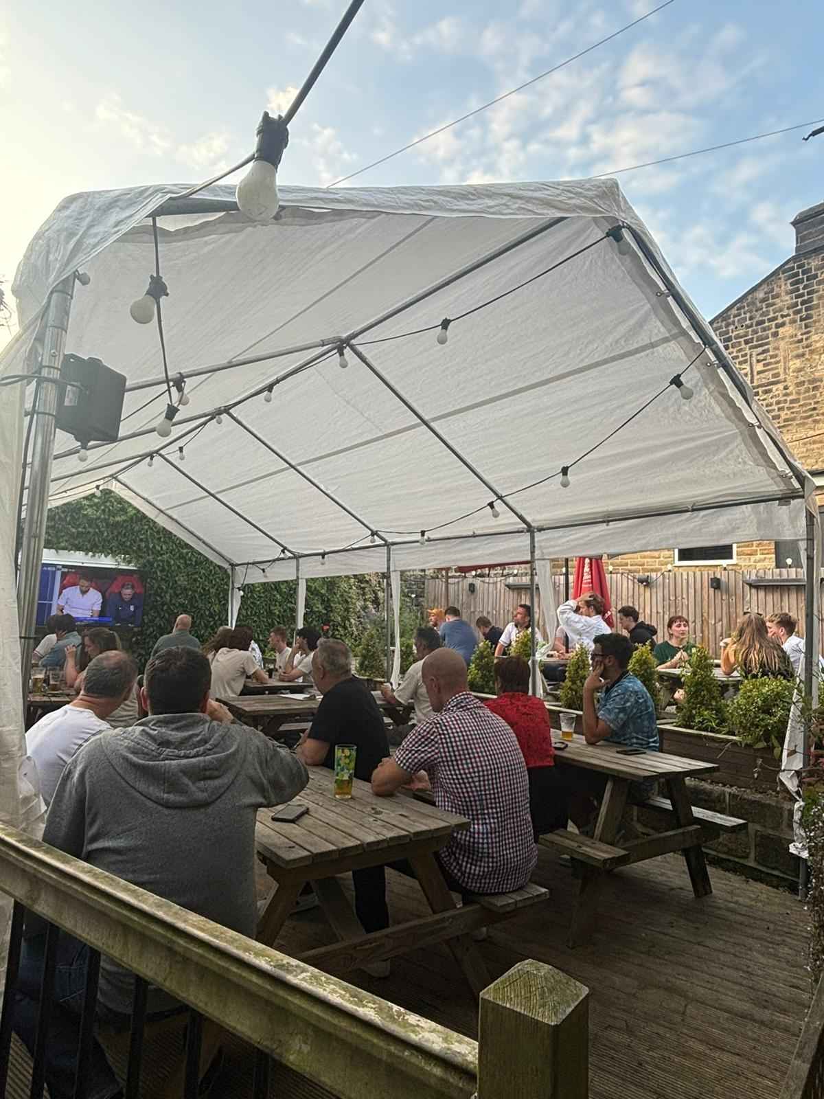 Covered seating area on the beer garden decking