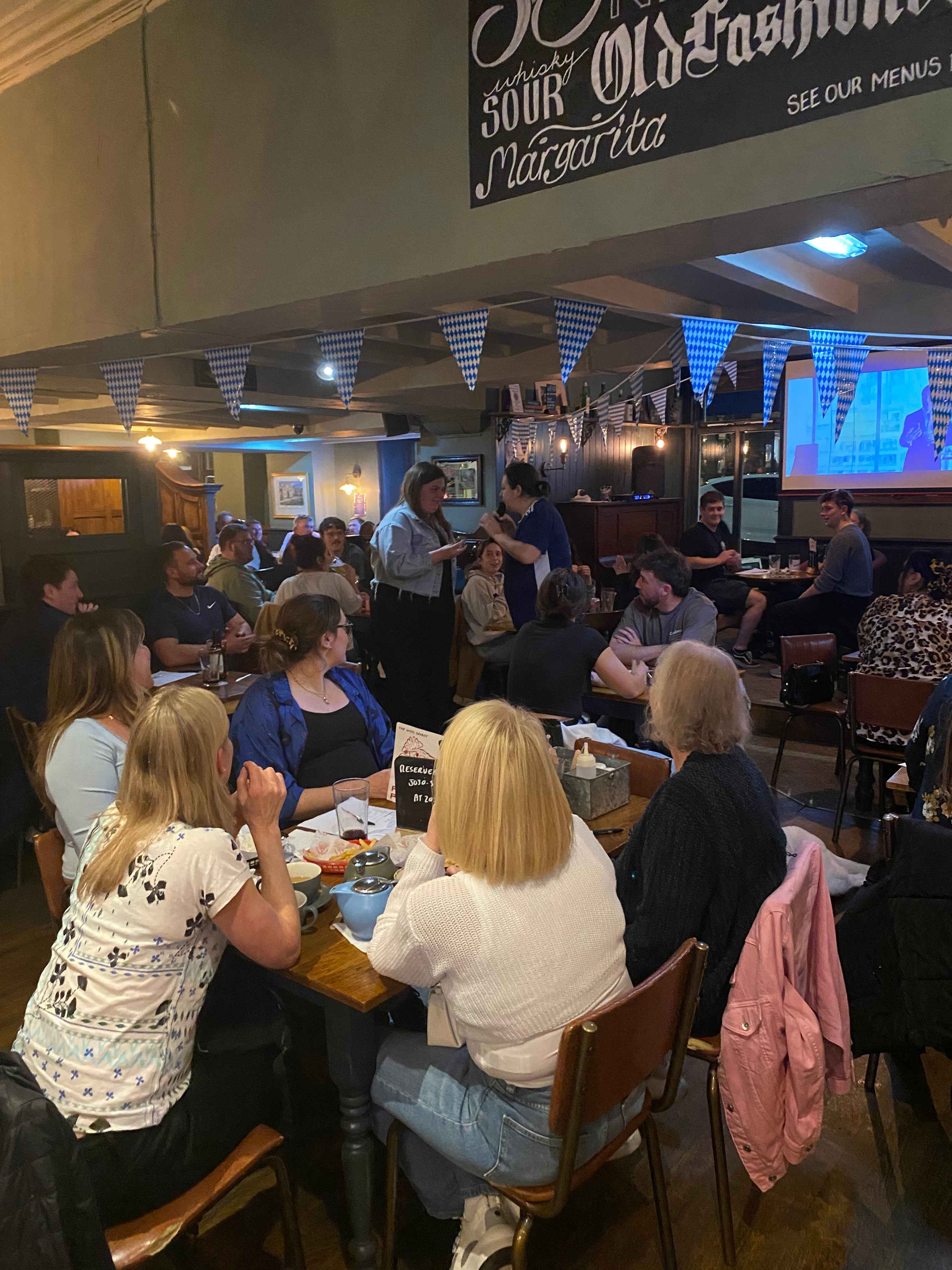 Wide interior view of The Old King’s Arms during an event