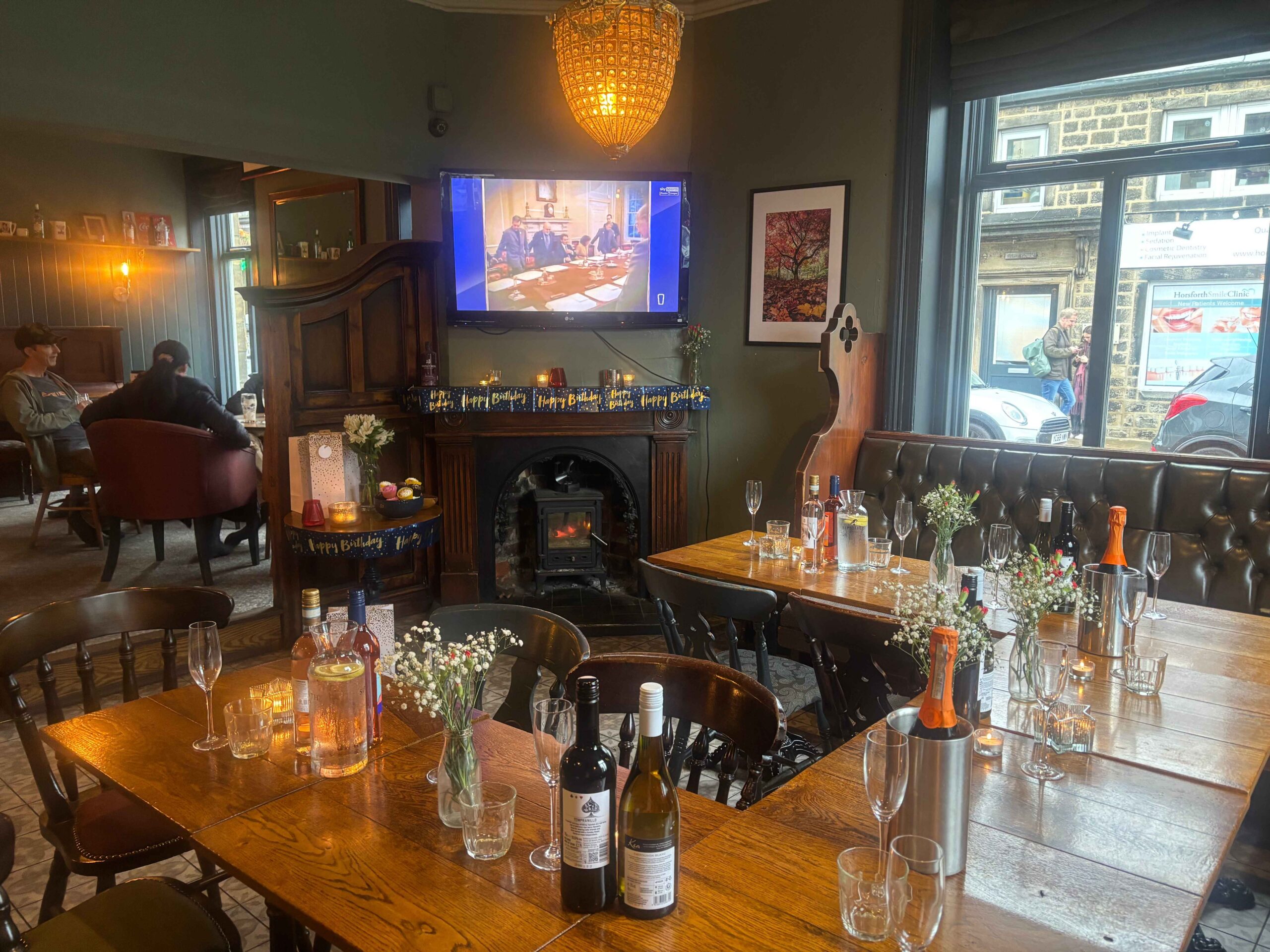 The Snug fireside function room-style space with seating in Horsforth